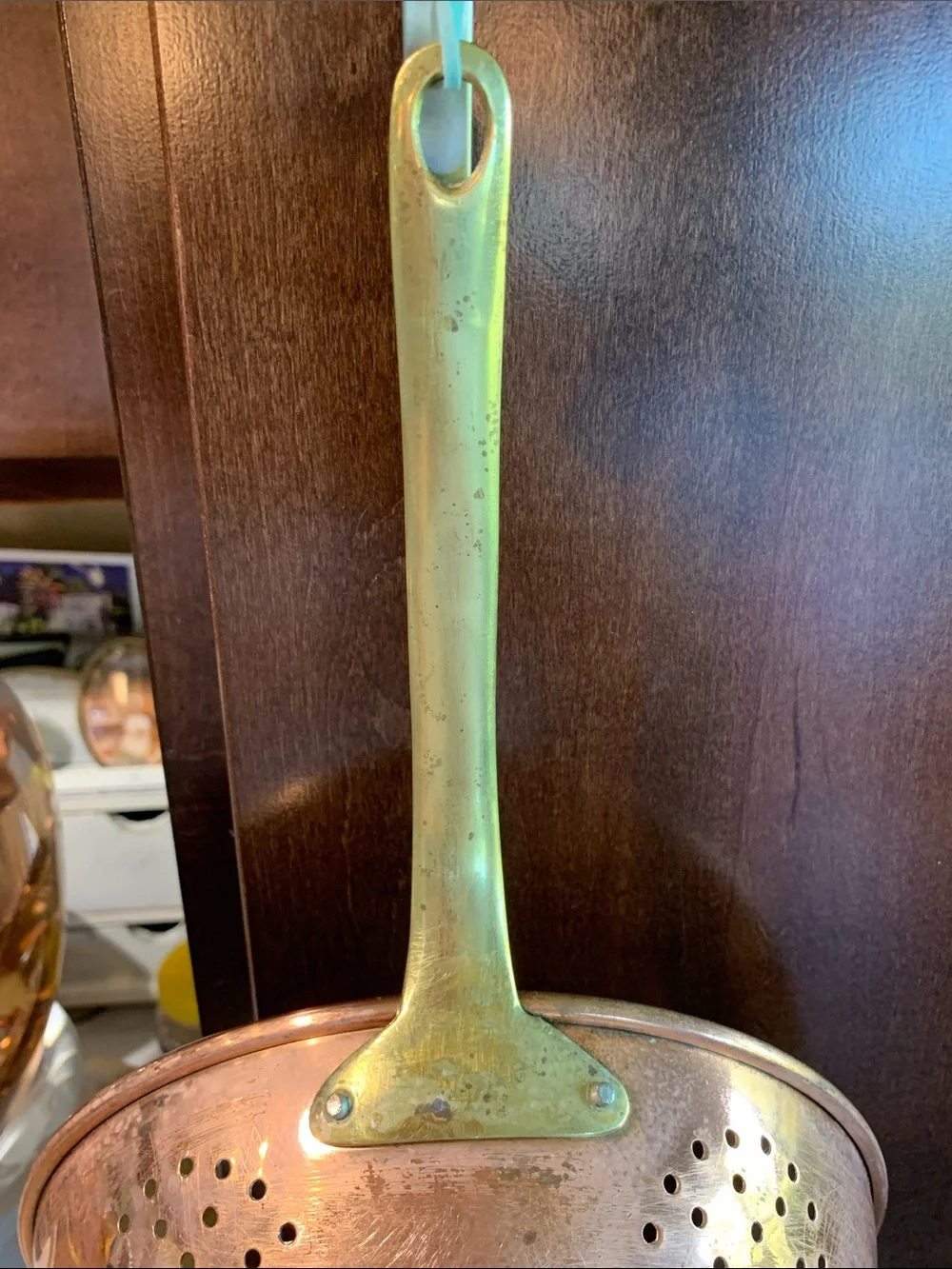 vintage copper colander strainer with a long brass handle 16”L